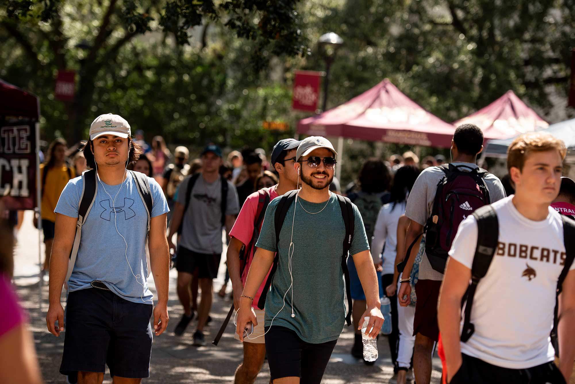students walking on texas state campus