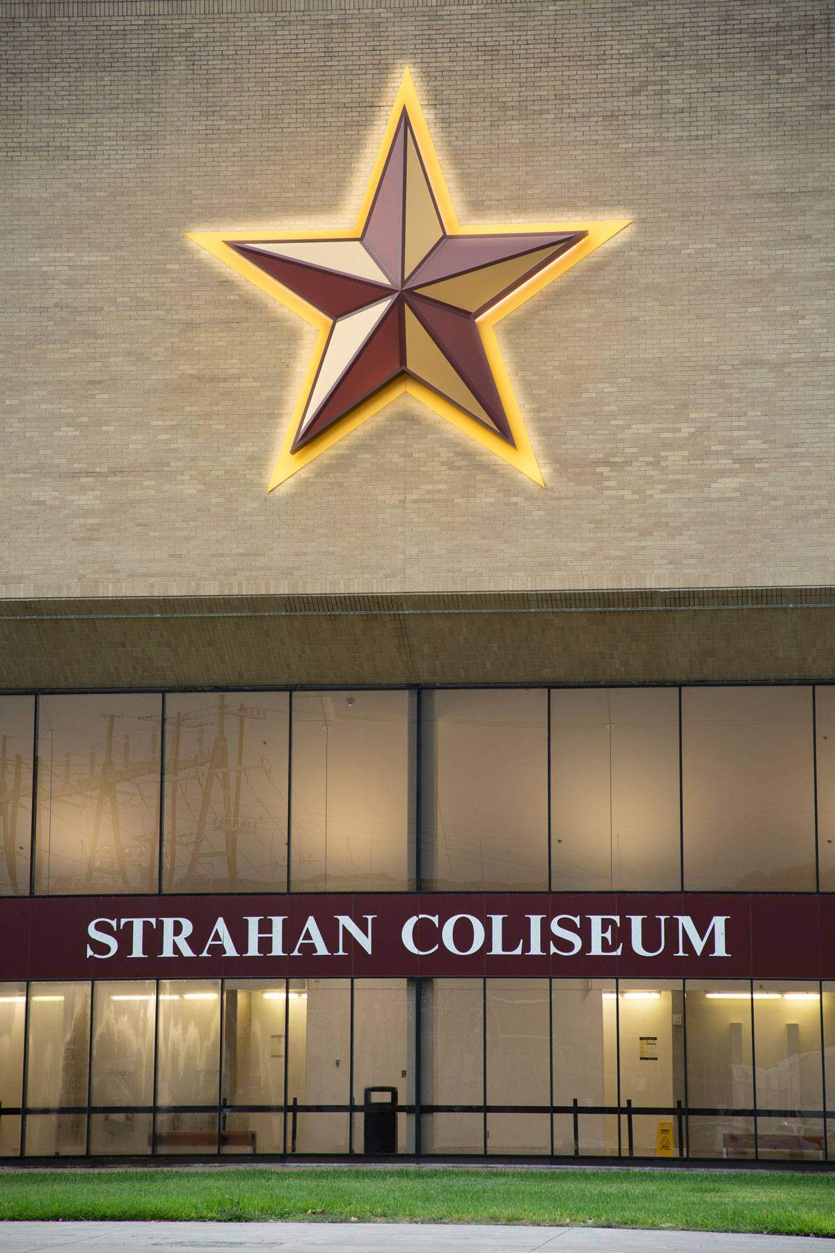 The Victory Star glows on the side of Strahan Arena