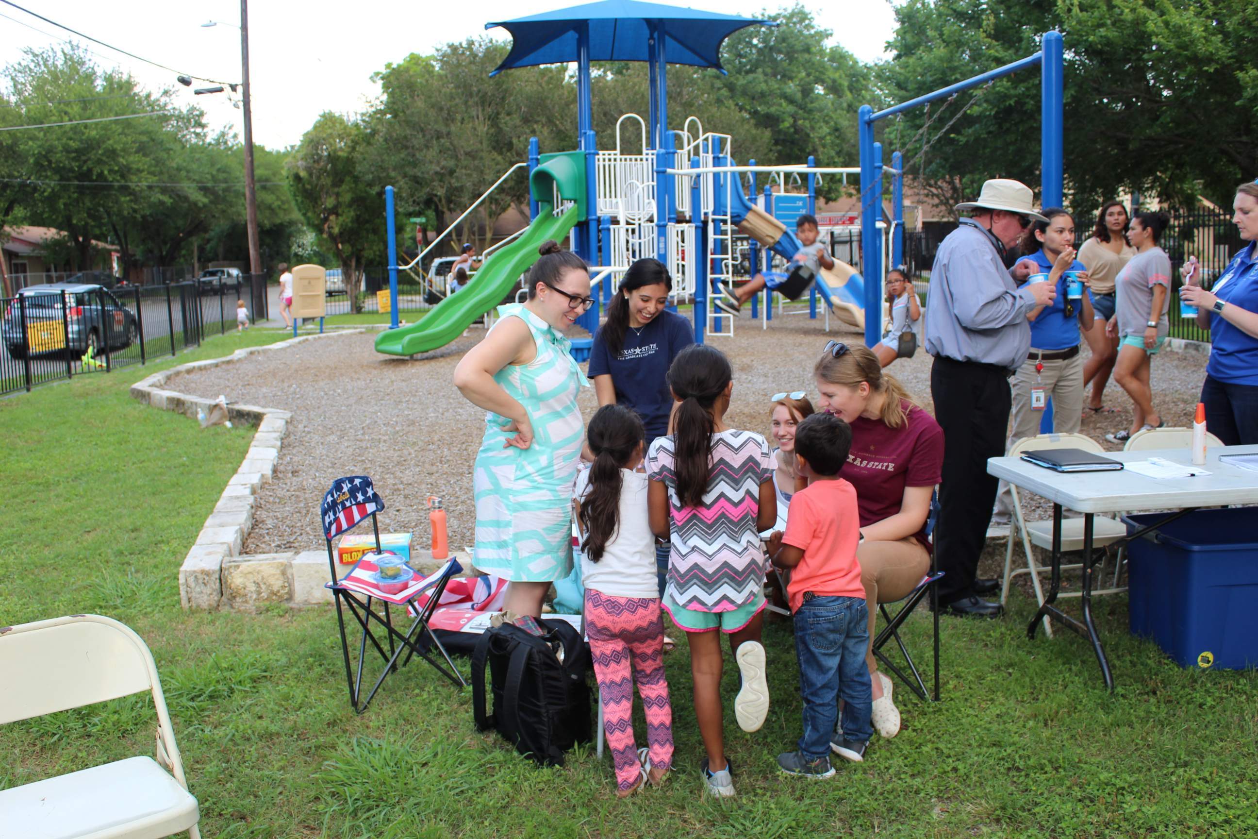 researchers and young children at park