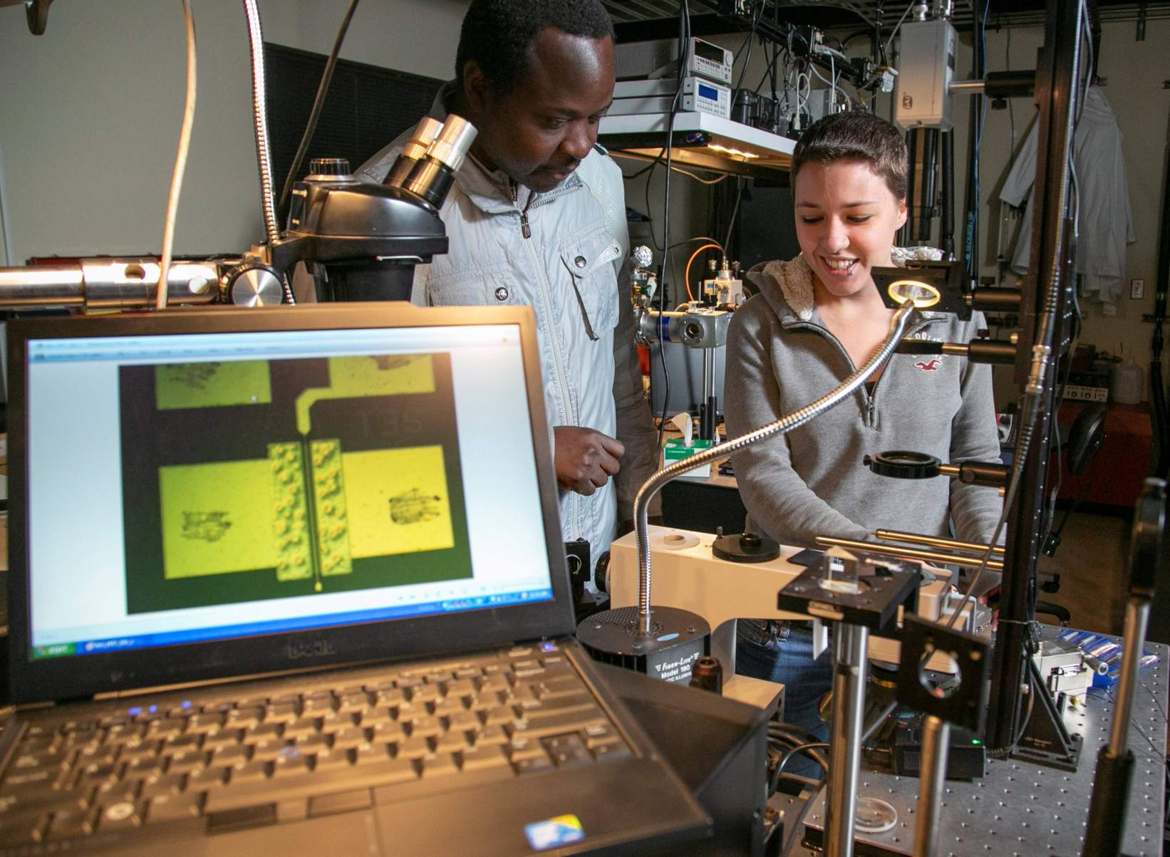 Two graduate students working in material science and engineering lab