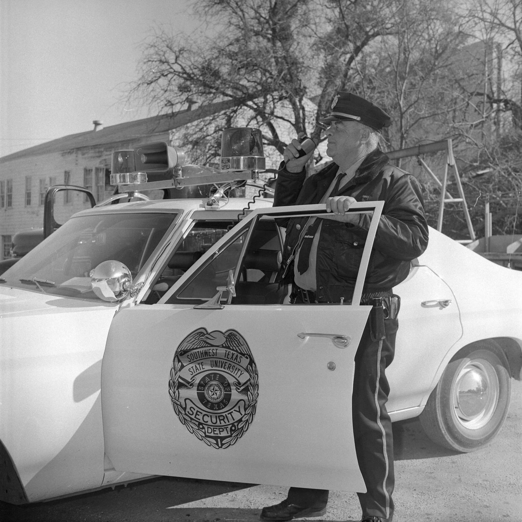 patrol officer Martin Randow poses with a new 1971 patrol car