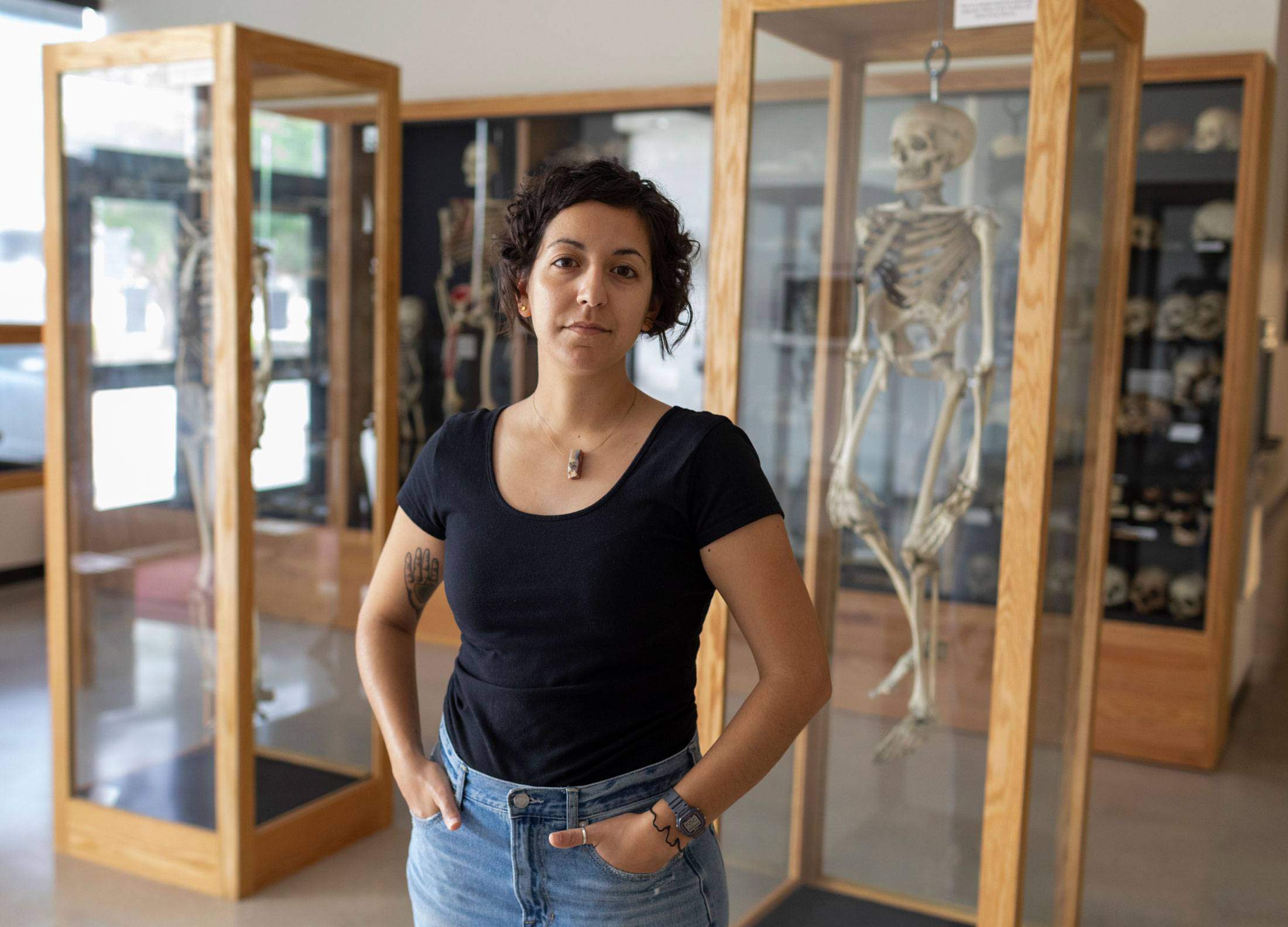 Megan Veltri standing in the anthropology lab