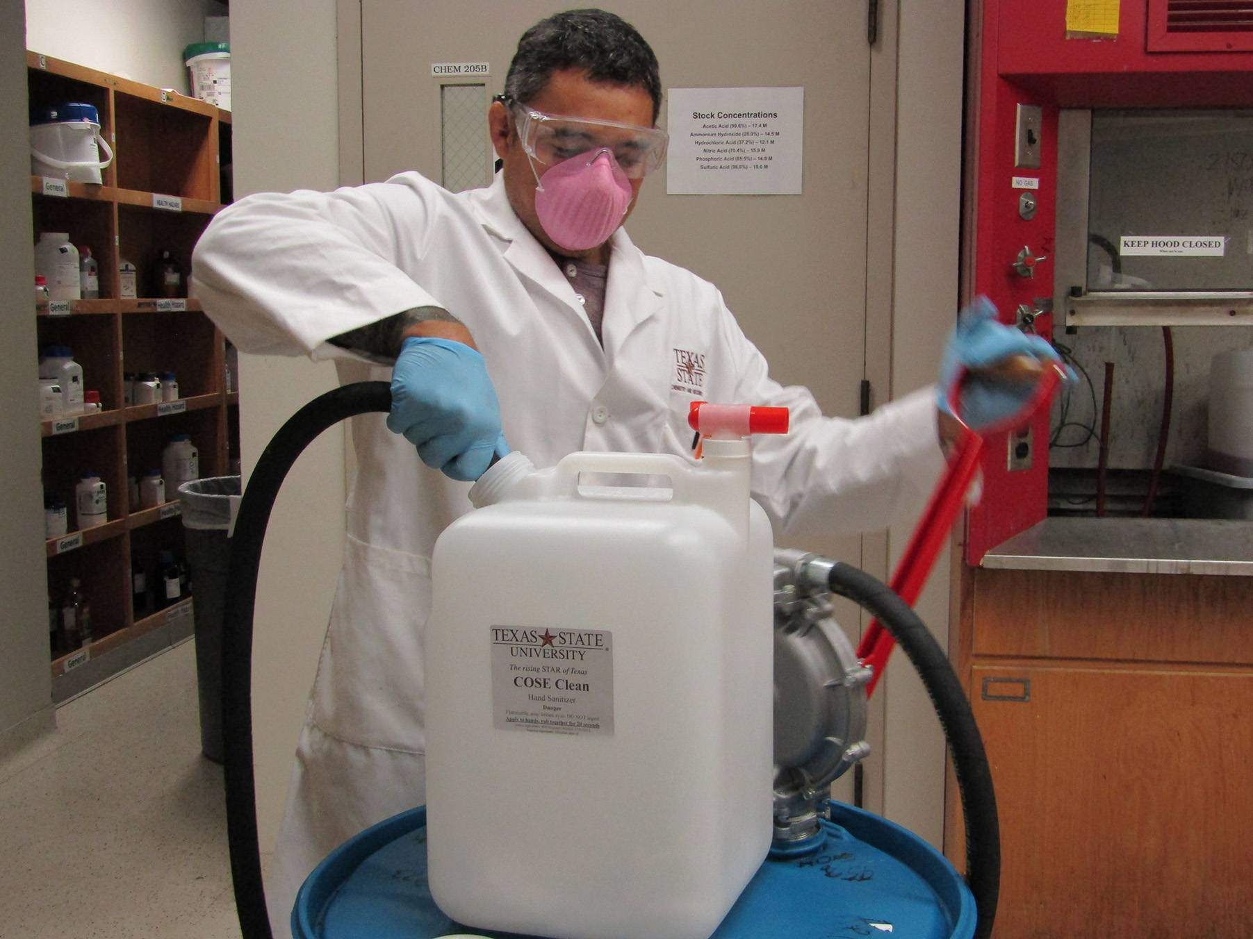 man working with chemicals in lab