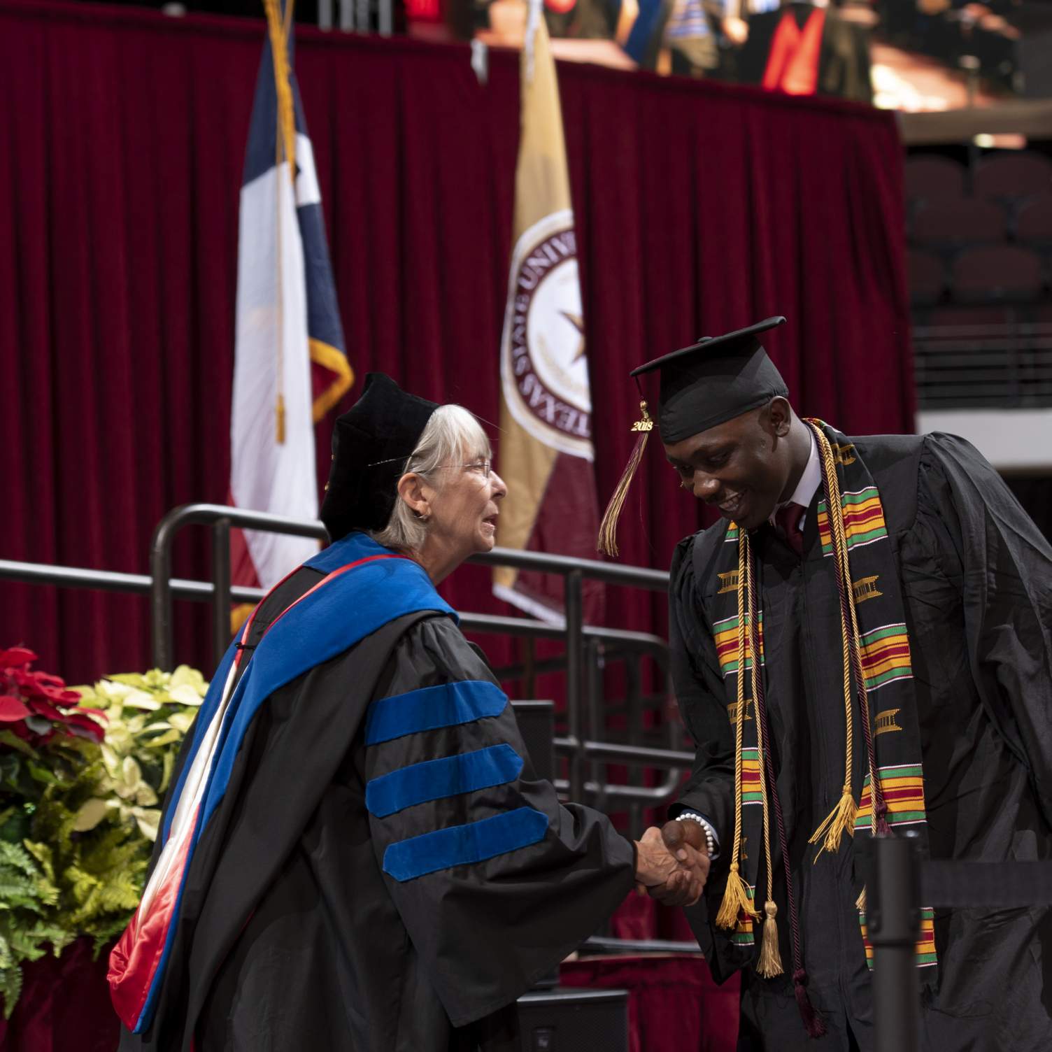 graduate shaking hands with Dean Hailey