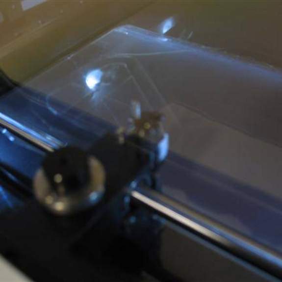 Image, fuzzy closeup of cutter inside machine.