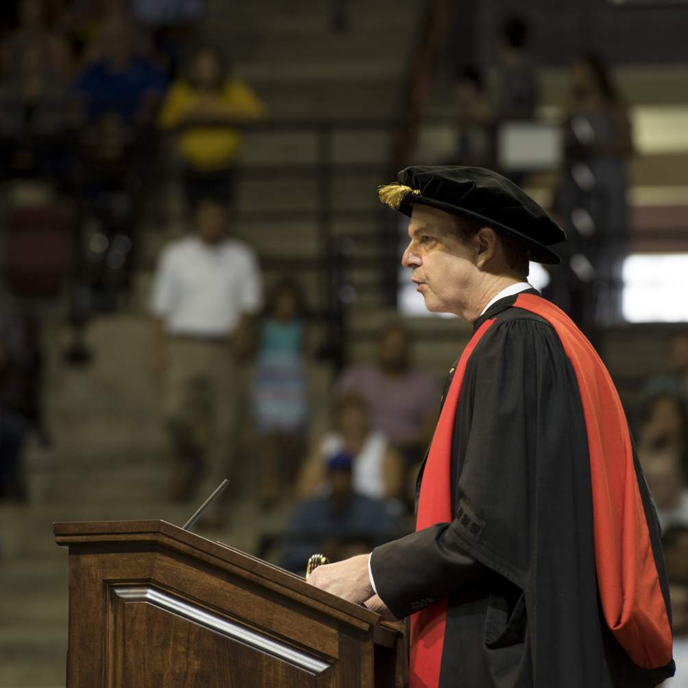 Provost Gene Bourgeois, Vice President of Academic Affairs, addresses graduating students at a Summer 2016 commencement ceremony.