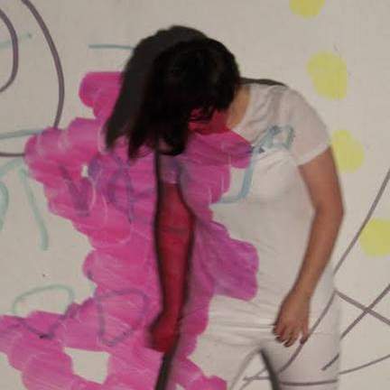 Student work: performance stills of a figure in all white moving in front of a projection of bright drawings