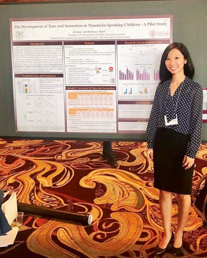 Dr. Yang with poster