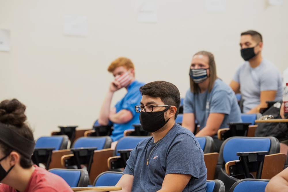 Students with masks on in a classroom