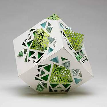 Student work: cube form with triangular cutouts and green organic forms emerging from the holes
