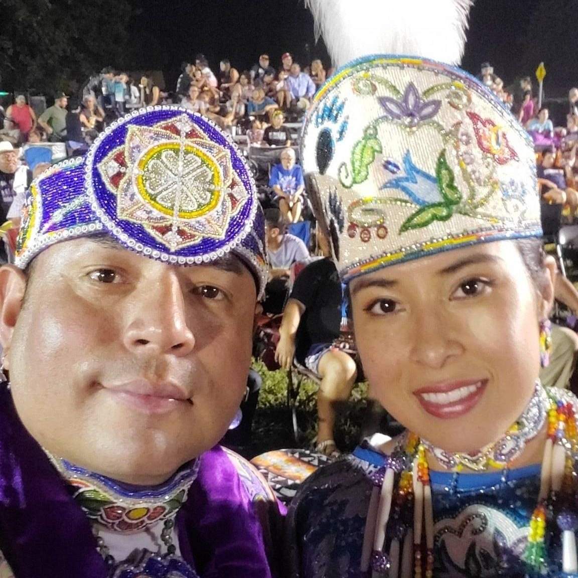man and woman in native american wardrobe