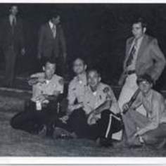 a group of SWT police officers watching a football game.