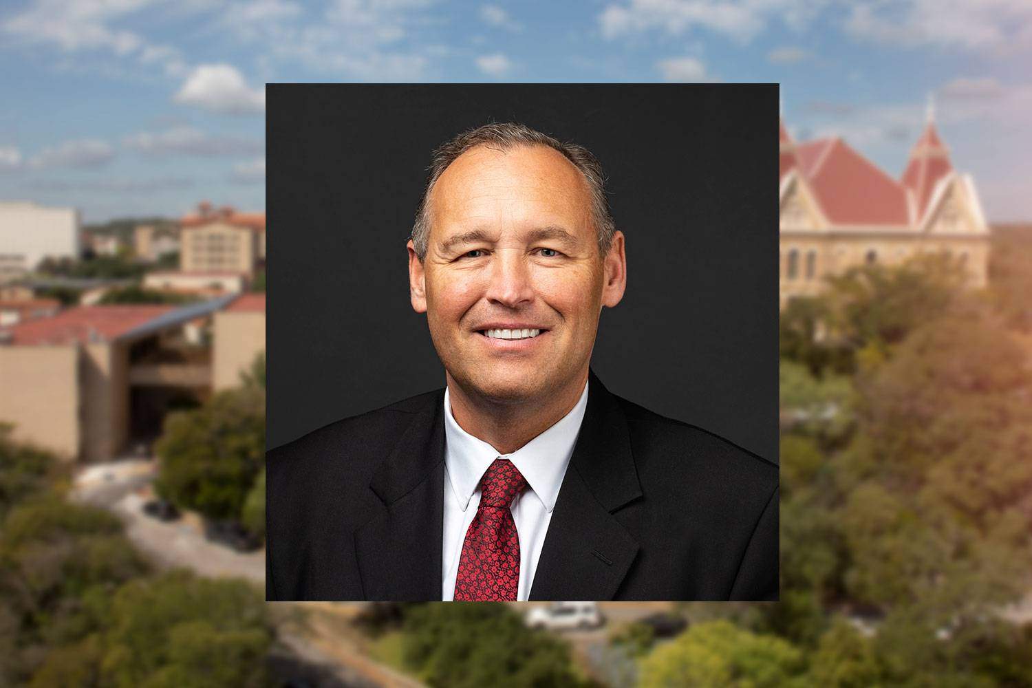 Headshot of Kelly R. Damphousse with Texas State in the background