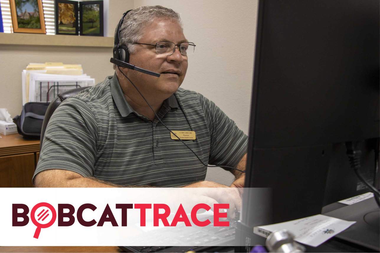 A man has on a phone headset and is typing on a keyboard at a computer. Bobcat Trace Logo is overplayed on image. Logo spells out "Bobcat Trace" and has the "O" replaced with a magnifying glass.