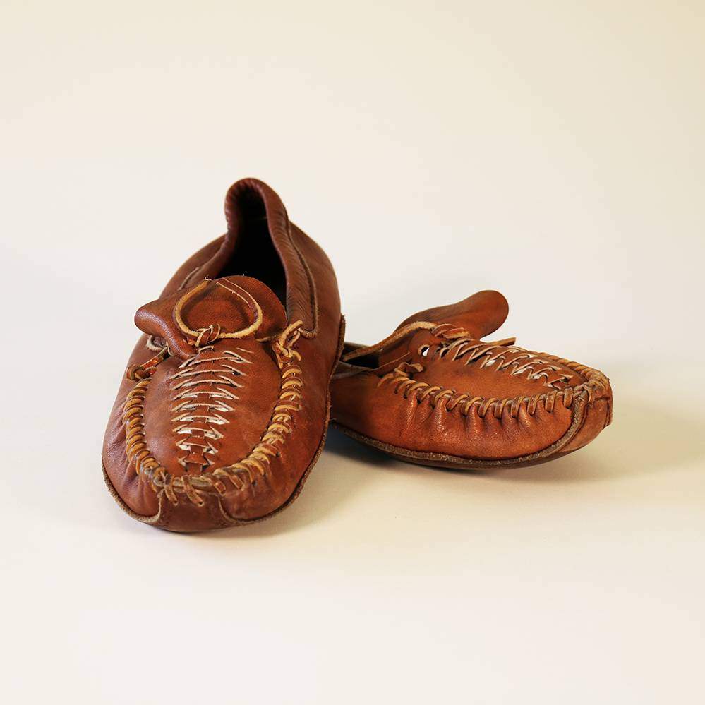 pair of brown leather moccasins 