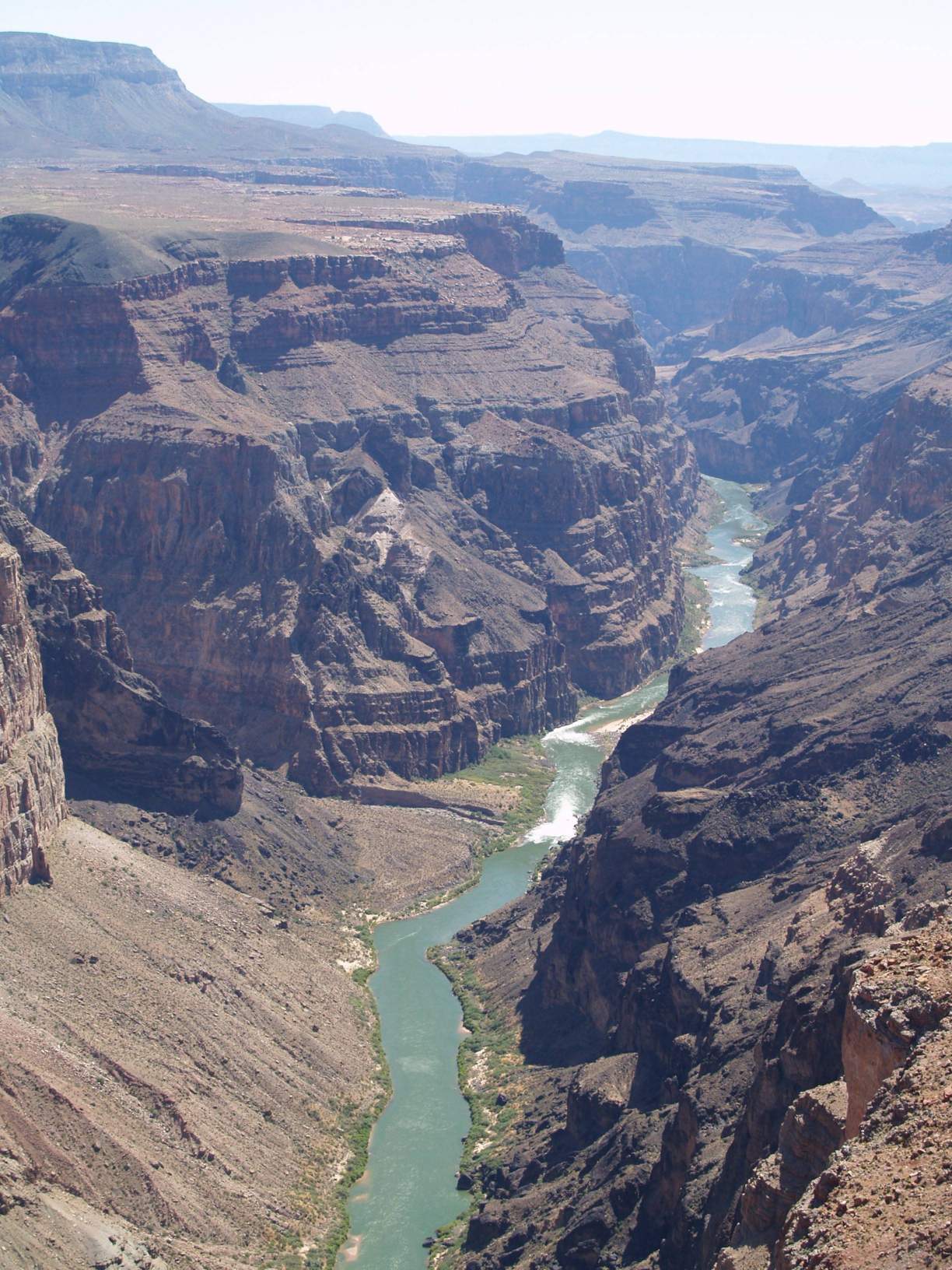 Arial view of a canyon in the Gray Mountains with a river at the bottom of the canyon.