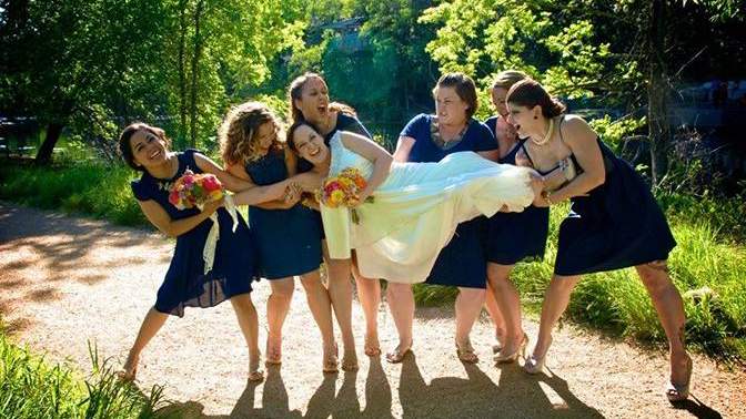 bride and bridesmaids celebrating at Spring Lake