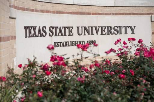 texas state university sign and pink flowers