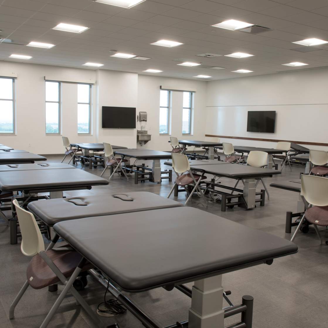 the inside of a classroom with desks made specifically for health professions studies