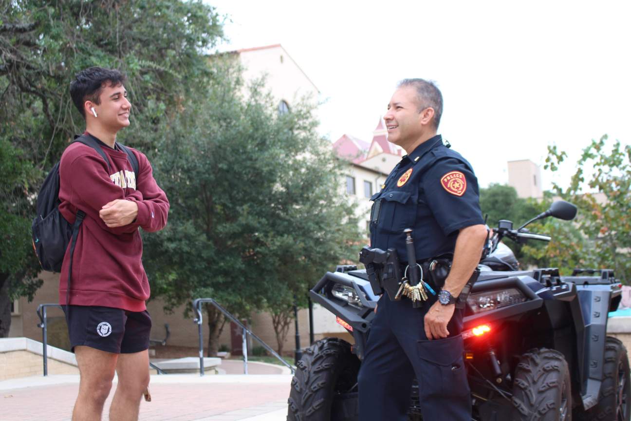 Officer chatting with a student
