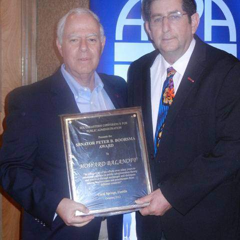 Steve Bobes (right), President of SECoPA presents Dr. Howard Balanoff with the Boorsma Award