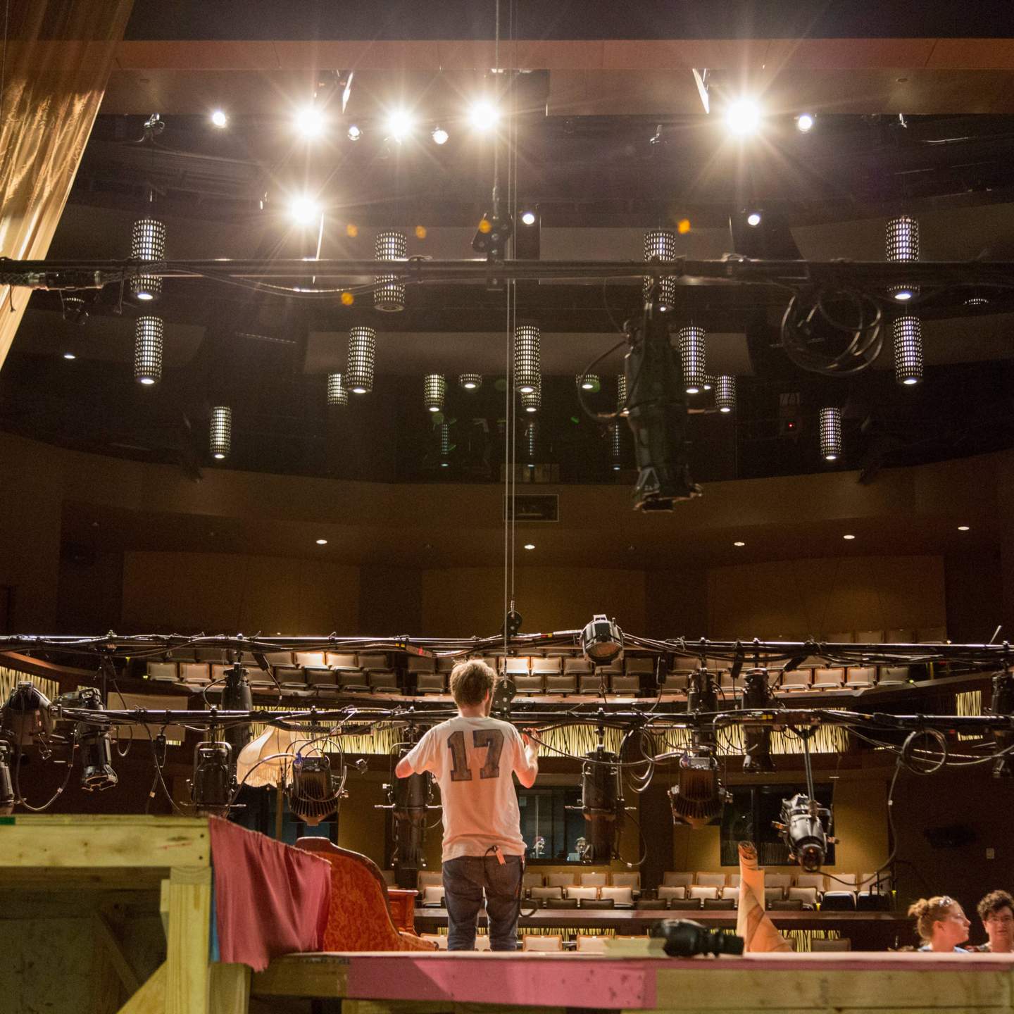 Students rig lights for Texas State’s production of Intimate Apparel.