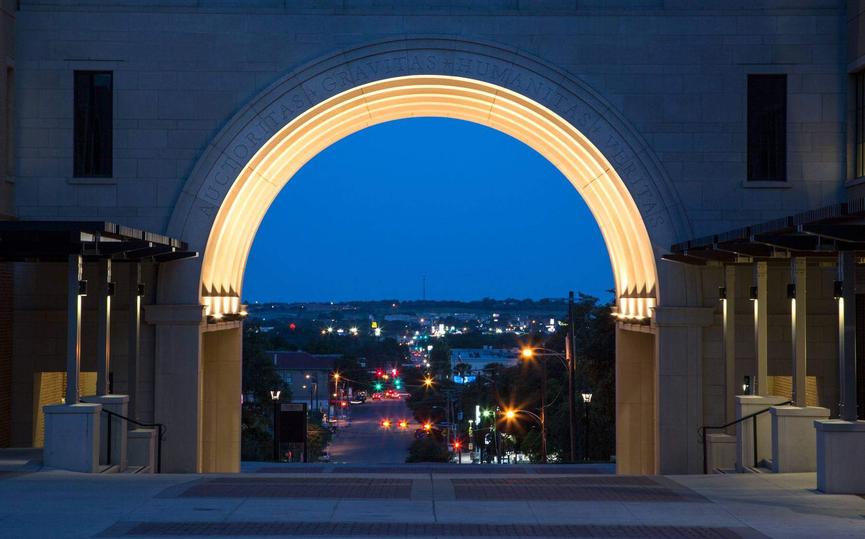 The UAC arch illuminated at dusk. 