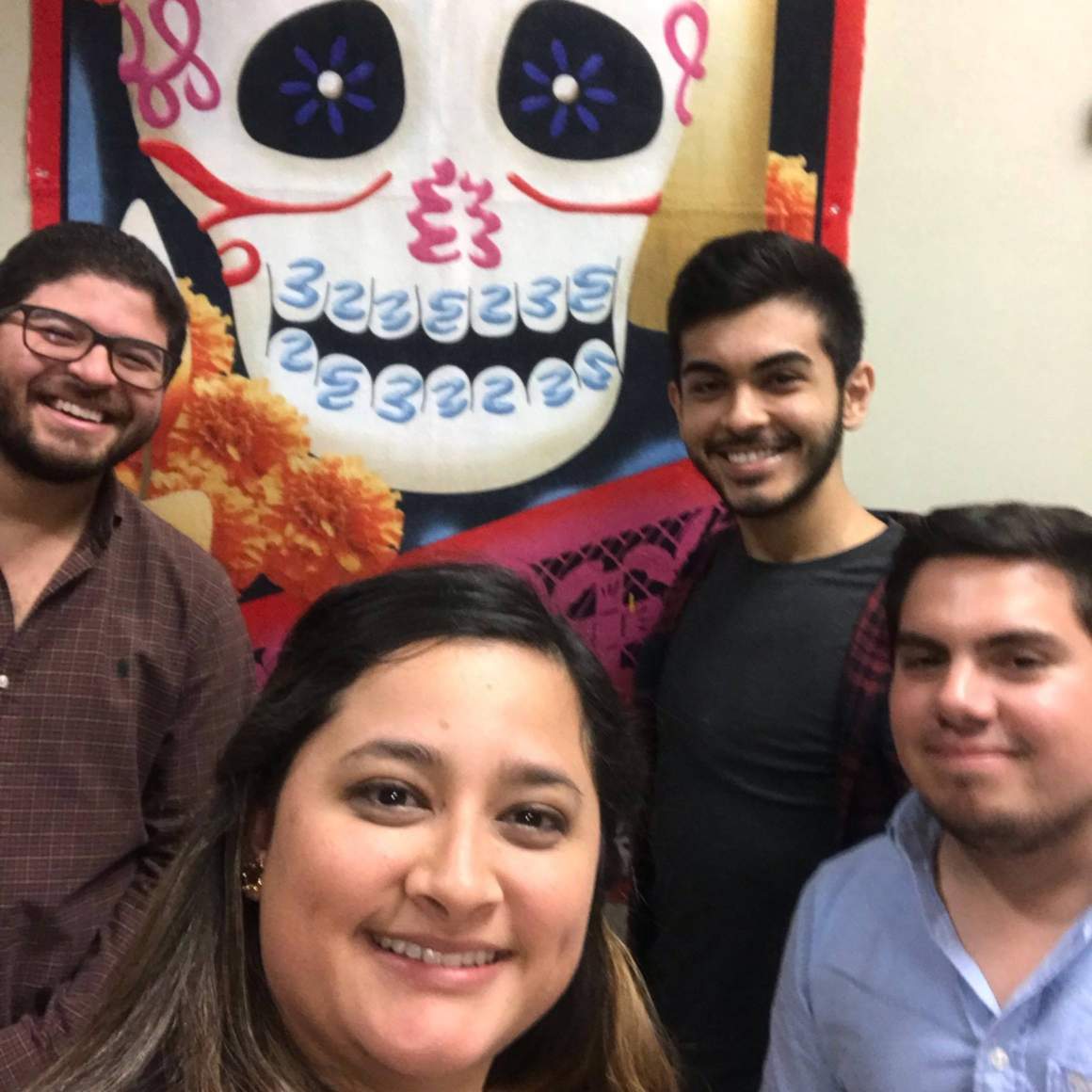 Students in front of a large calavera