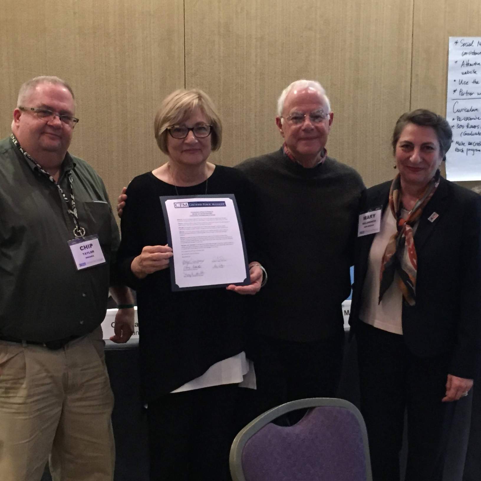 Howard & Marilyn Balanoff (center left & center right) receive Proclamation of Appreciation from Mary DeLorenzo, Chair of the NCPM Consortium (right) & Chip Taylor, Chair Elect of NCPM Consortium (left).