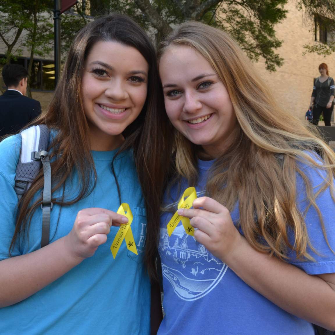 Students hold yellow ribbons in honor of Veterans Day