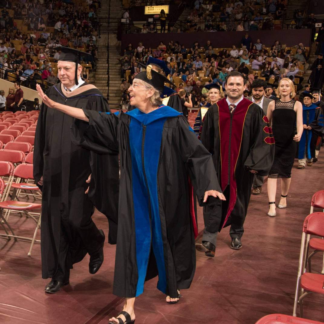 faculty walking down center aisle during processional