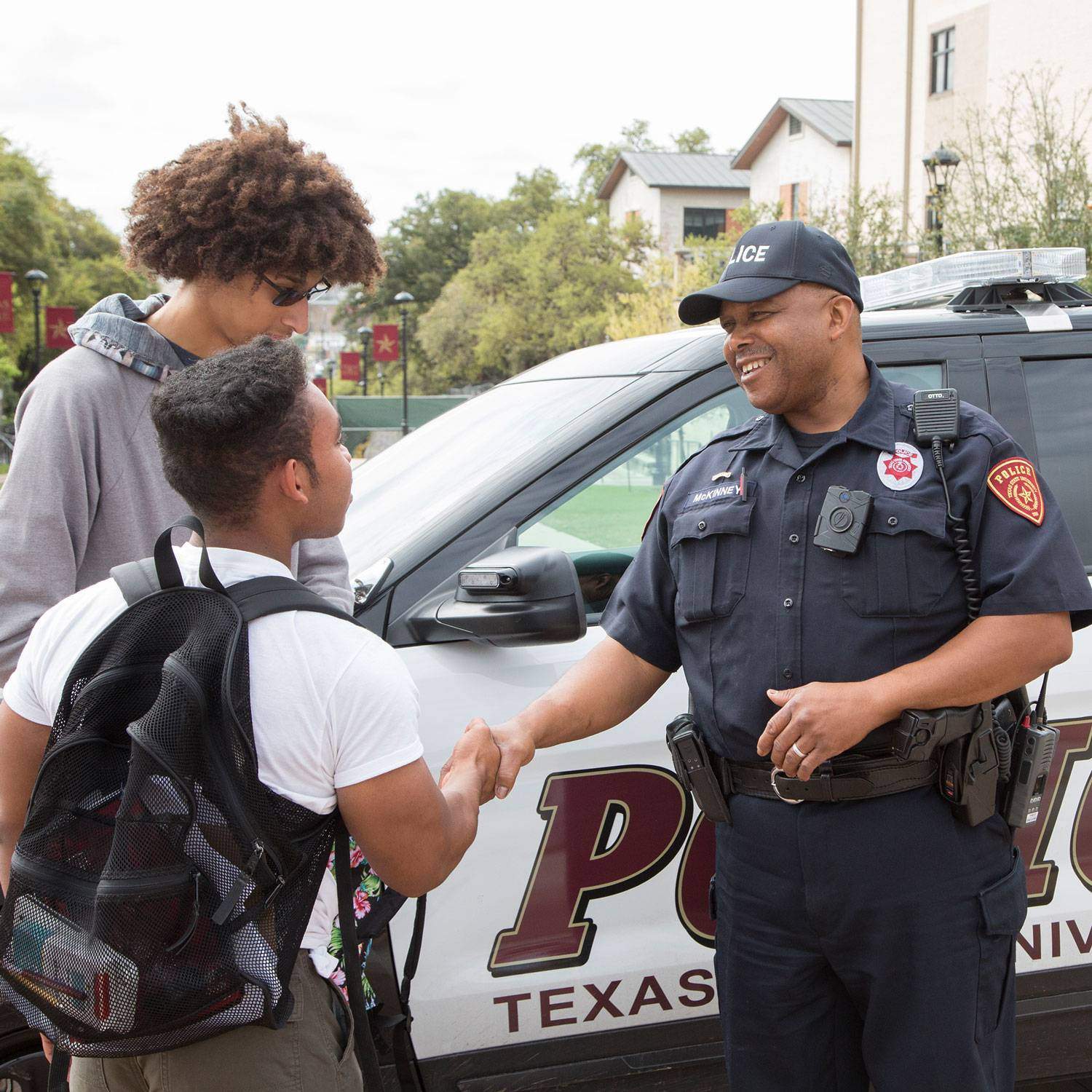 A UPD officer meets with students