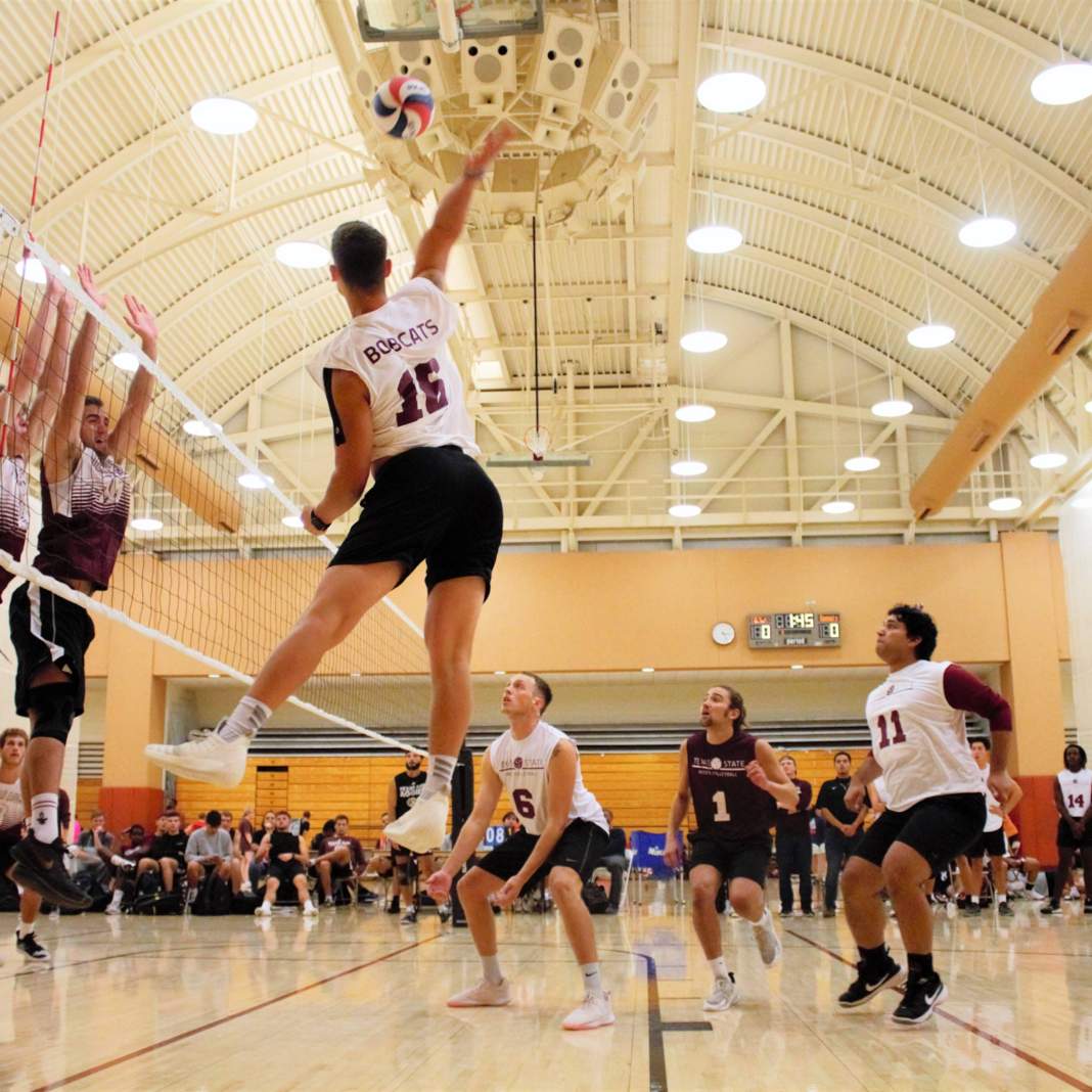 Men's Volleyball attempts a spike 3