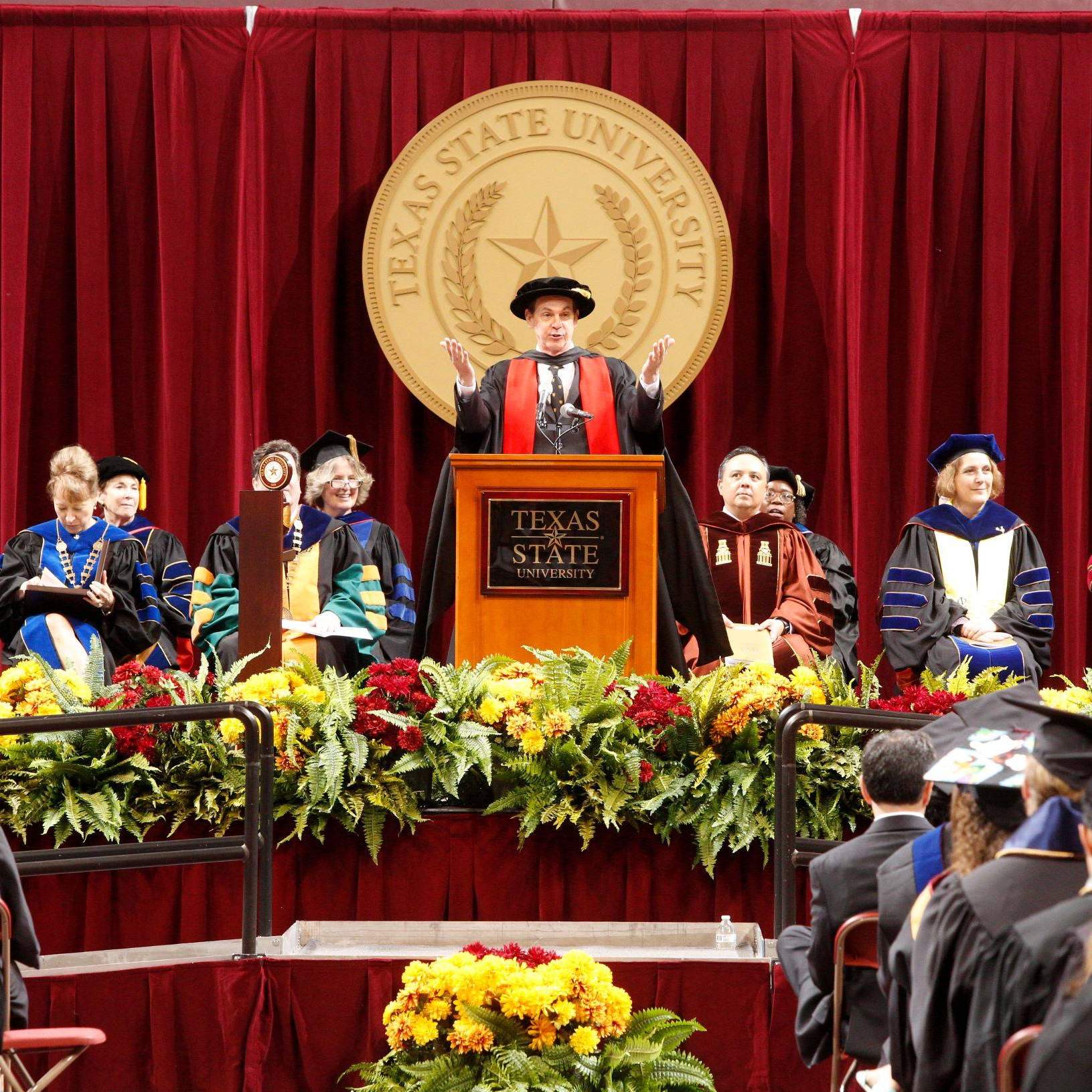 Provost Gene Bourgeois, Vice President of Academic Affairs, addresses graduation candidates at the Spring 2016 Texas State University commencement ceremonies.