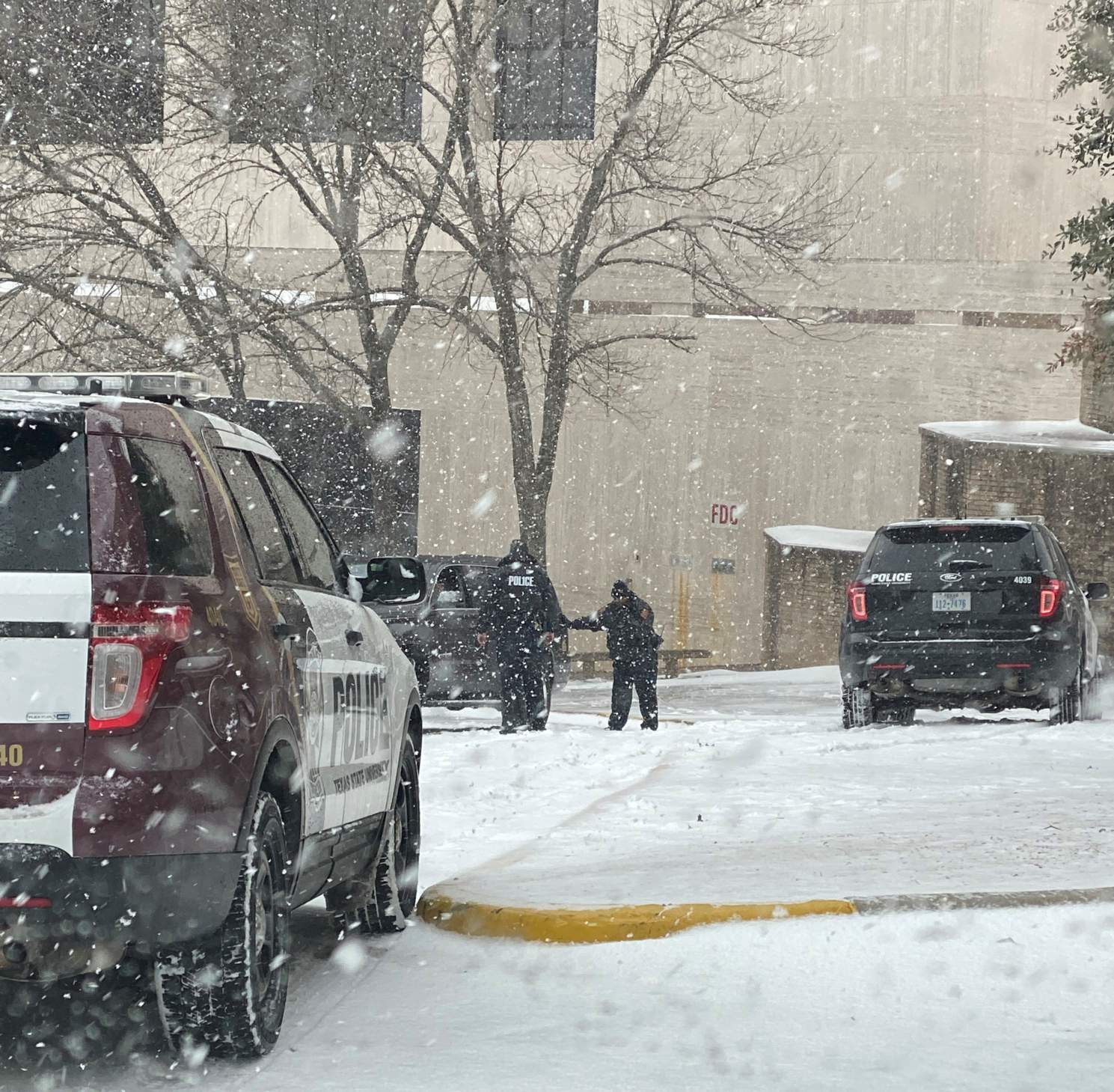 police officers responding to call in snow
