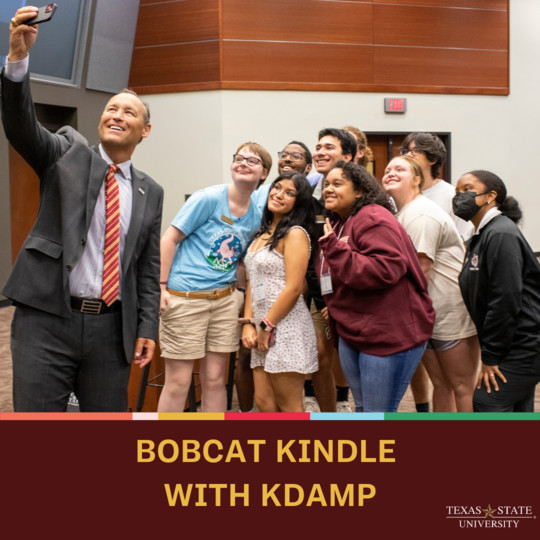 dr. damphousse taking a selfie with a group of students