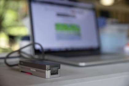a small DNA sequencer connects to a laptop