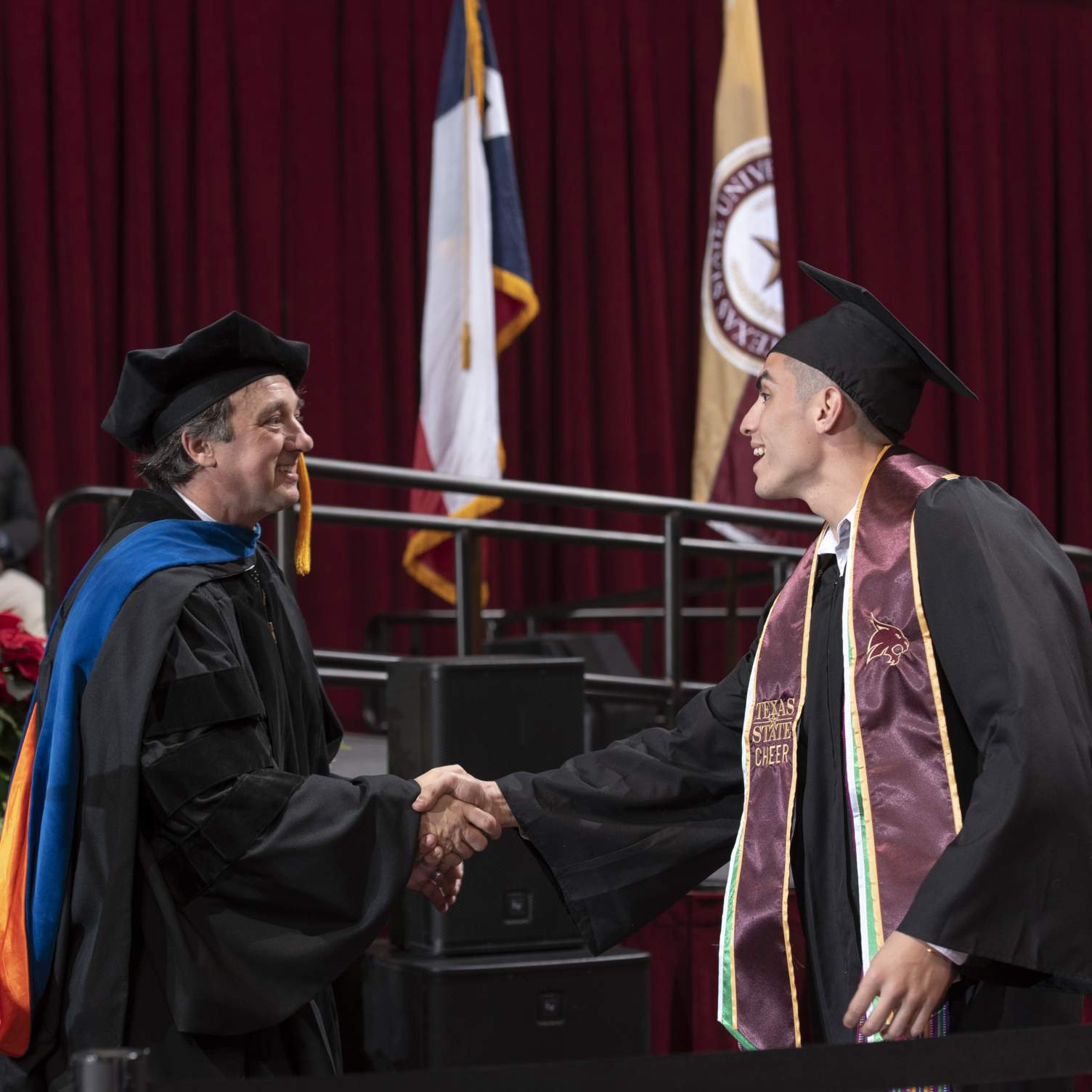 graduate shaking hands with Dean Fleming