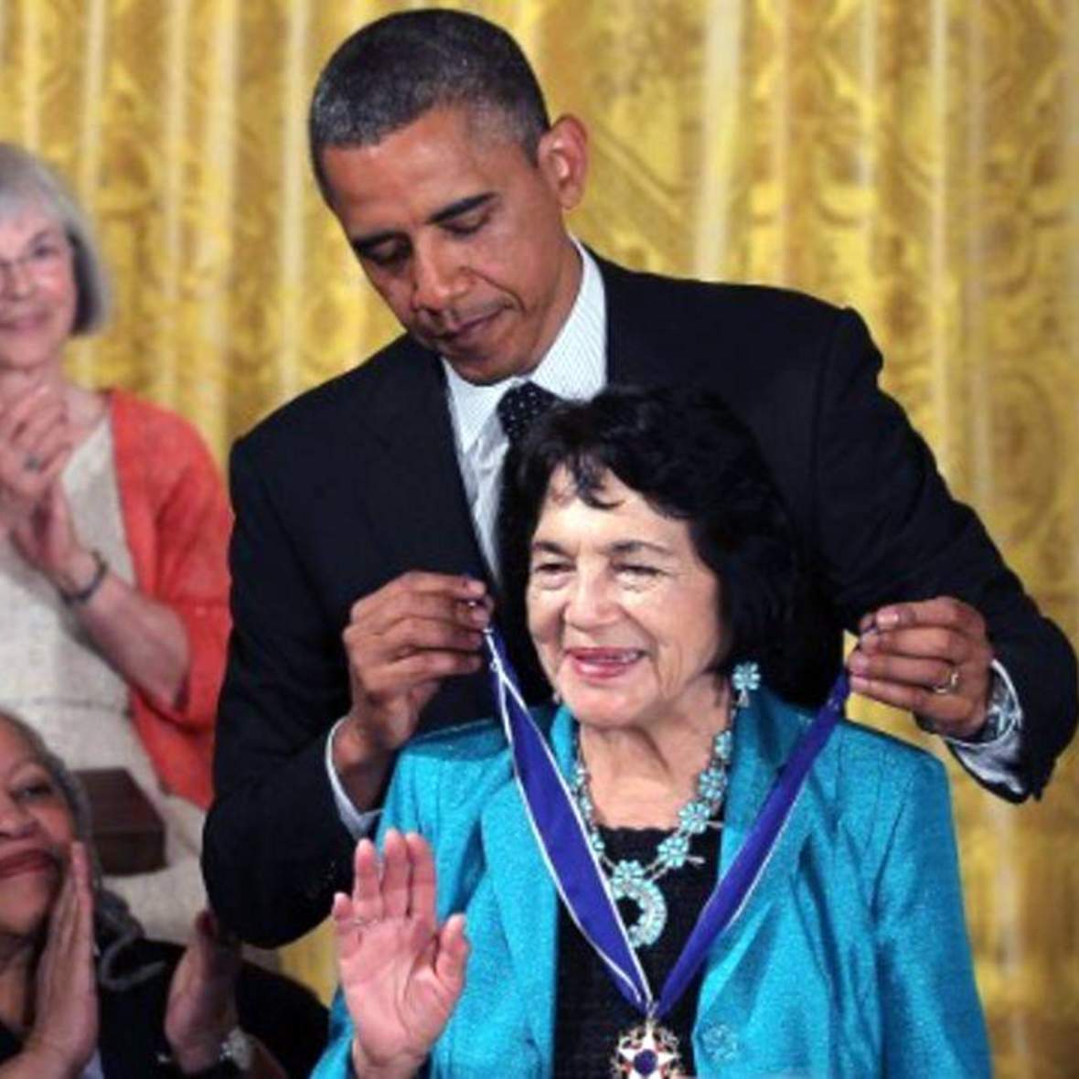 Dolores Huerta receiving a medal from President Barack Obama