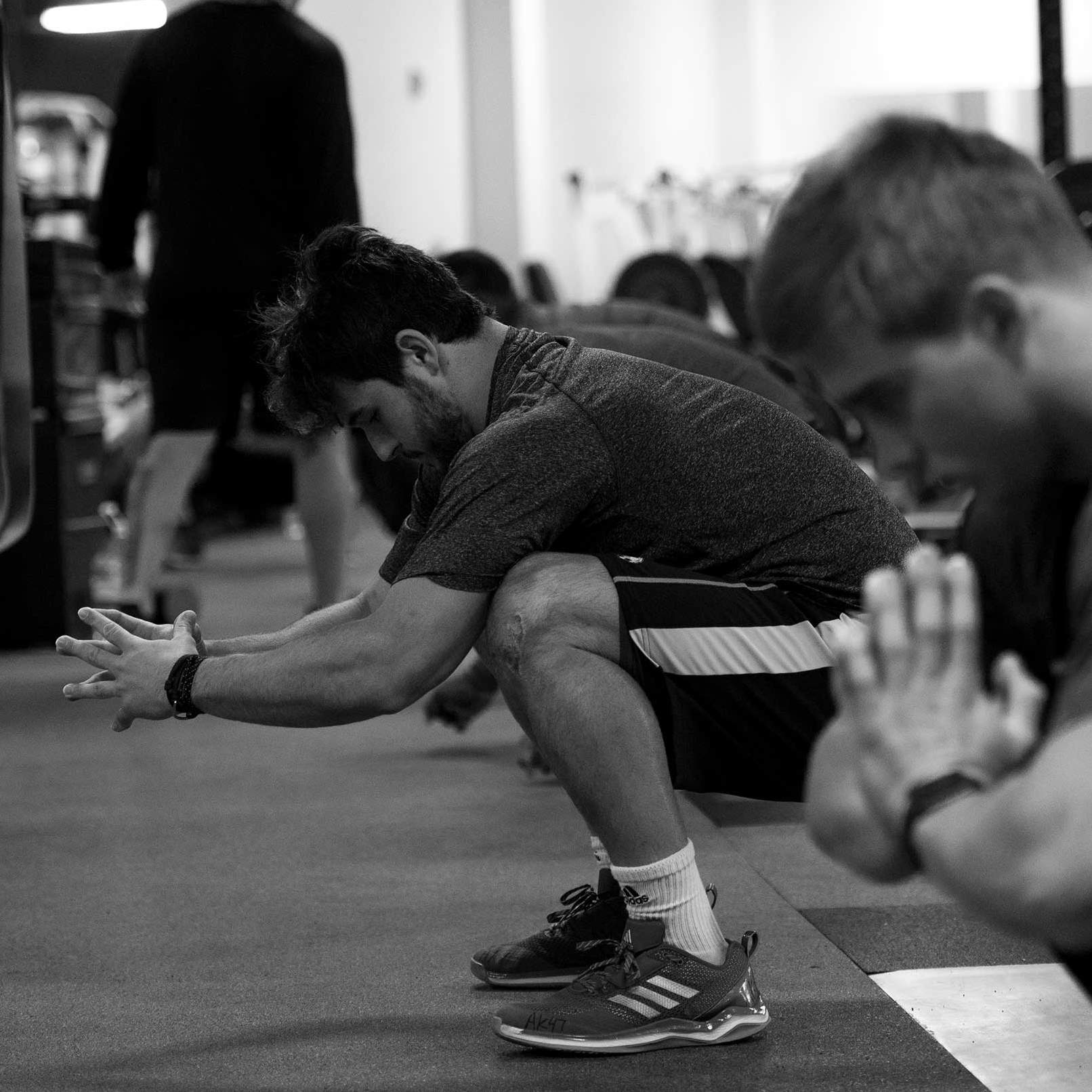 AJ Krawczyk does a squat during a workout