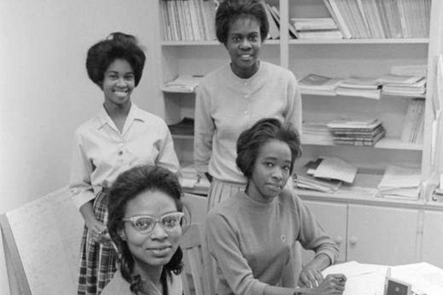 black and white photo of four young black women
