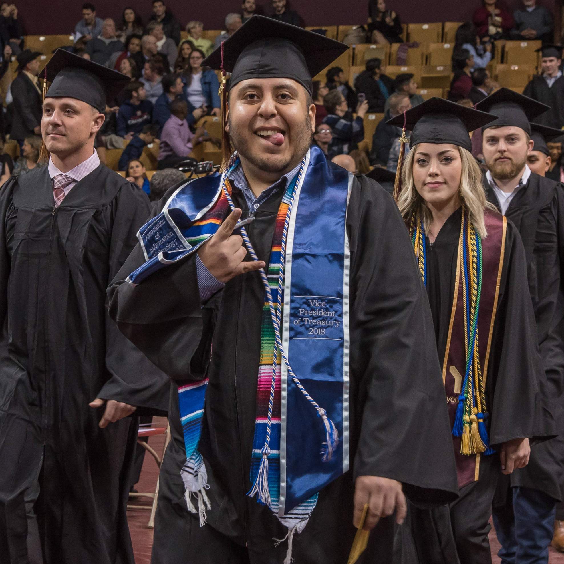 graduates walking down aisle
