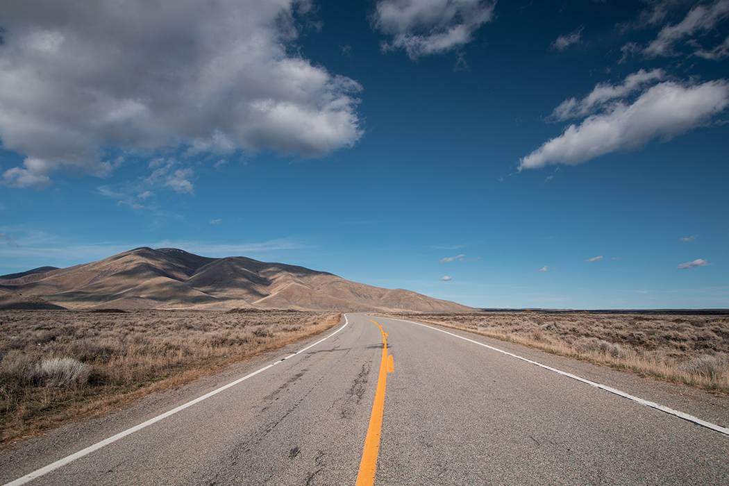 A road in Idaho leading to a National Park.