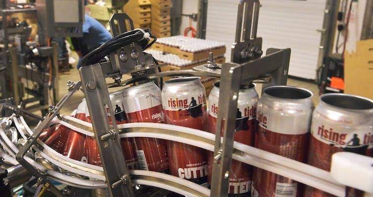 empty craft beer cans on production line