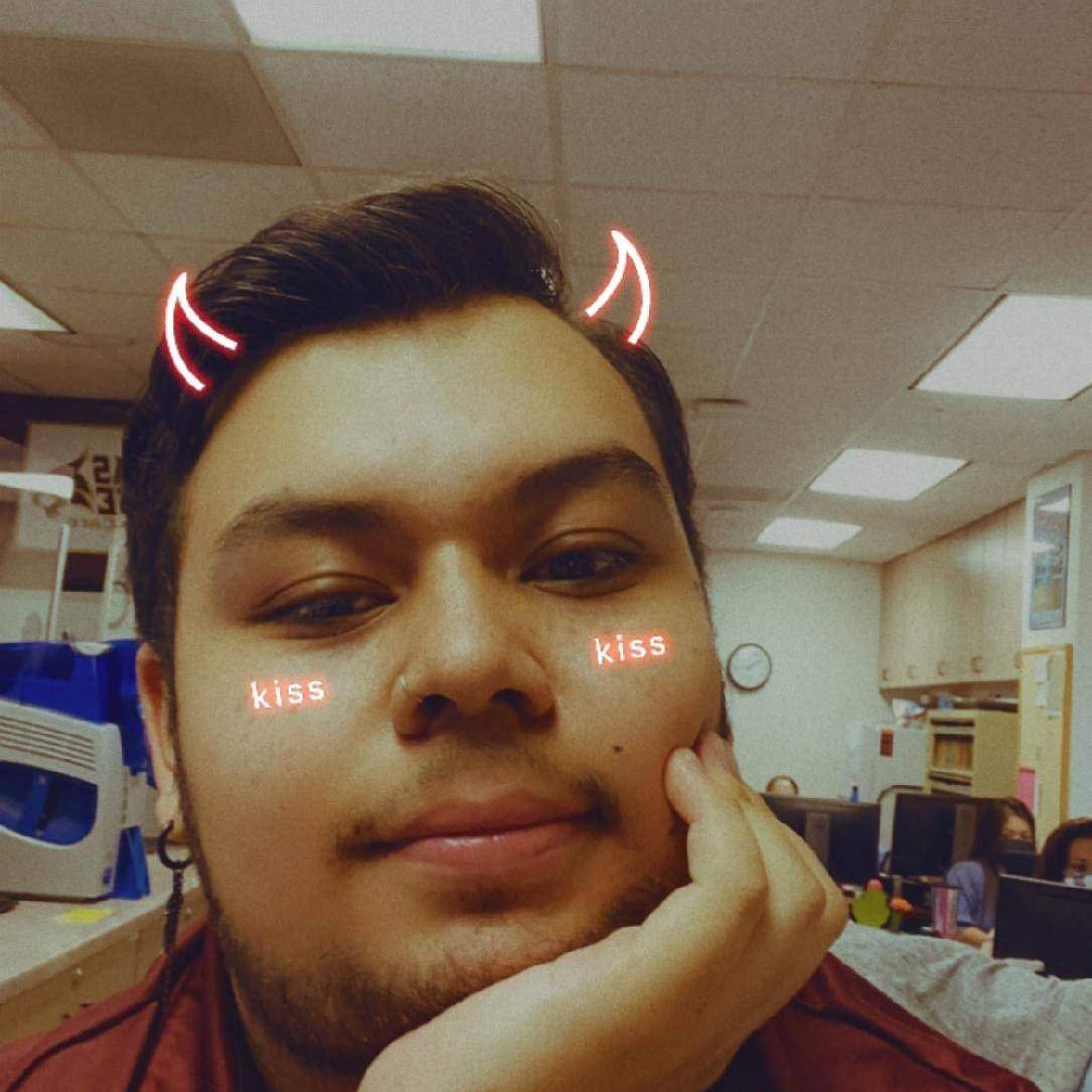 student photo with devil horns filter