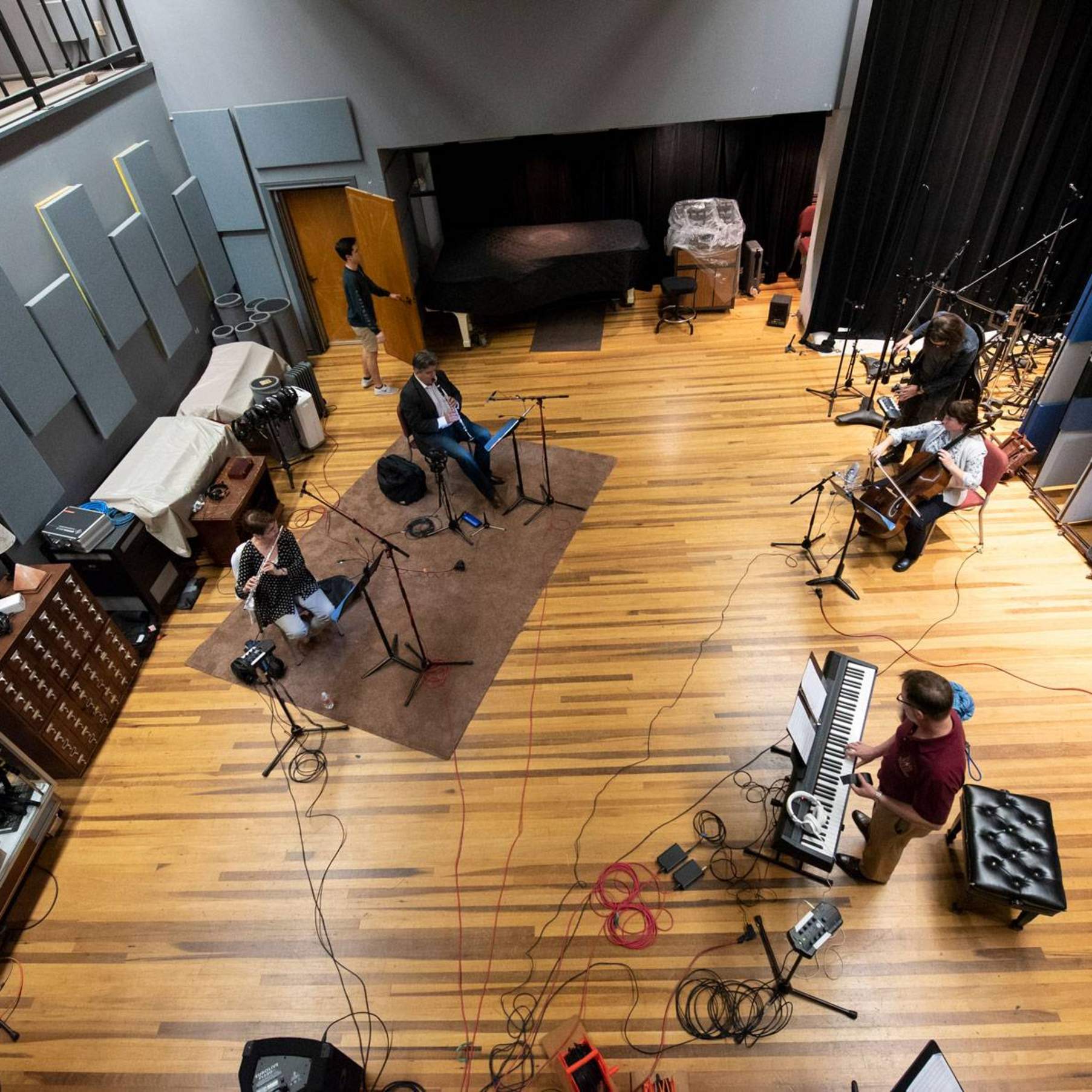 overhead of a recoding studio with musicians