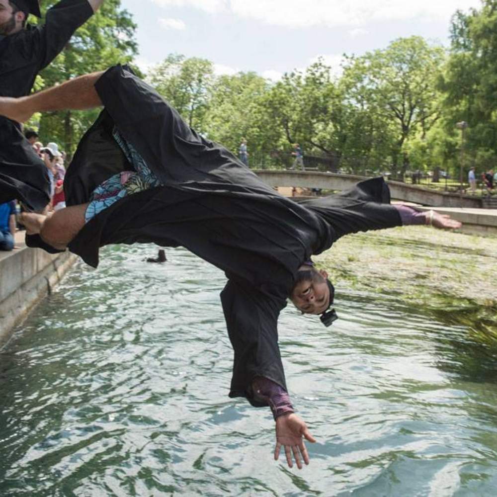 graduate frontflips into the river
