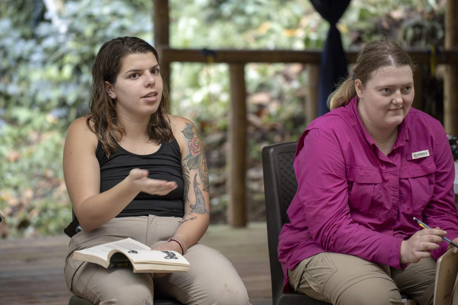 two female students lead a classroom discussion