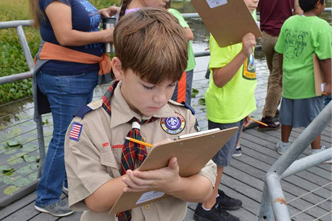 boy scout at wetlands boardwalk