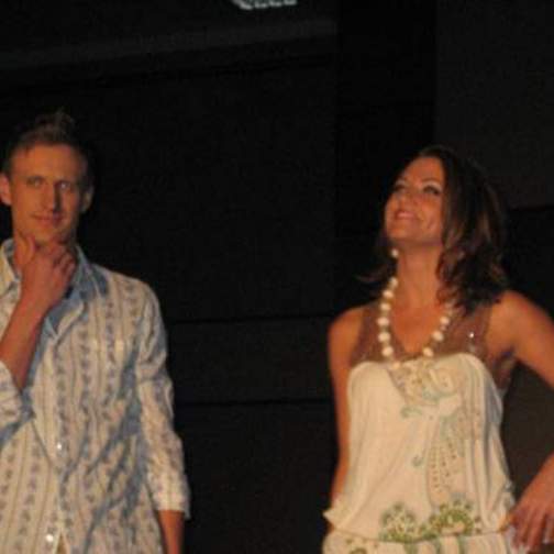 Male and female student/model on the runway at the fashion show.